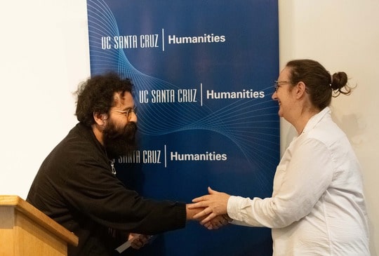 Two faculty shaking hands