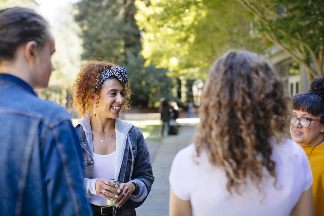 Students and Faculty talking in Humanities Courtyard