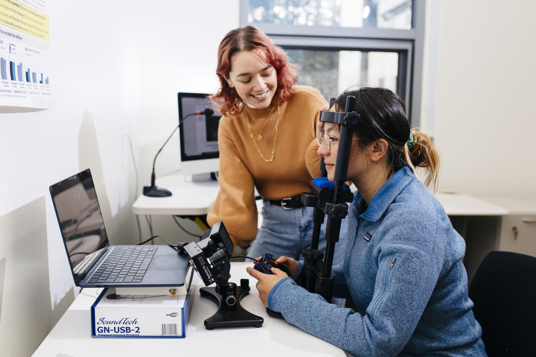 Two students performing research together