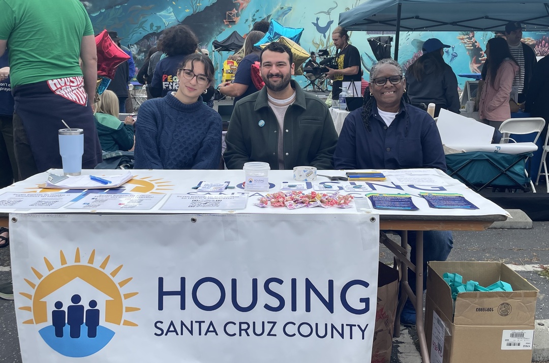 Housing Santa Cruz County staff behind a booth